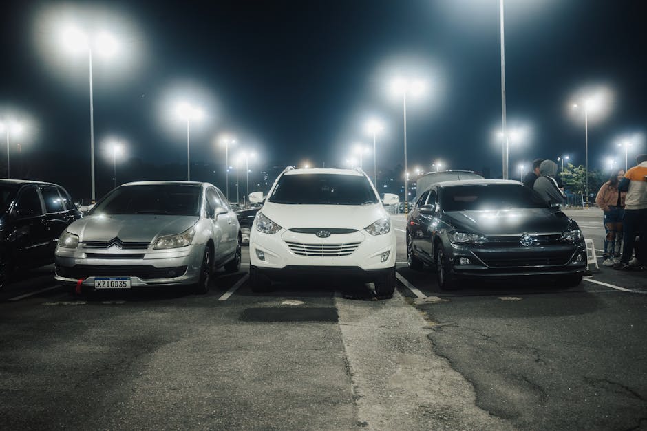 Underside of a parked truck showing exposed exhaust pipe where a catalytic converter was removed