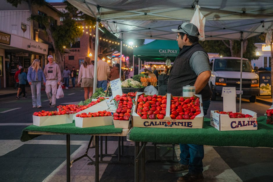 Colorful farmers market scene with fresh strawberries and a lively outdoor atmosphere